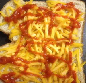BreadCheeseSriracha Put a bread slice on the girdle, cover it with sharp cheddar cheese, add some Sriracha sauce.