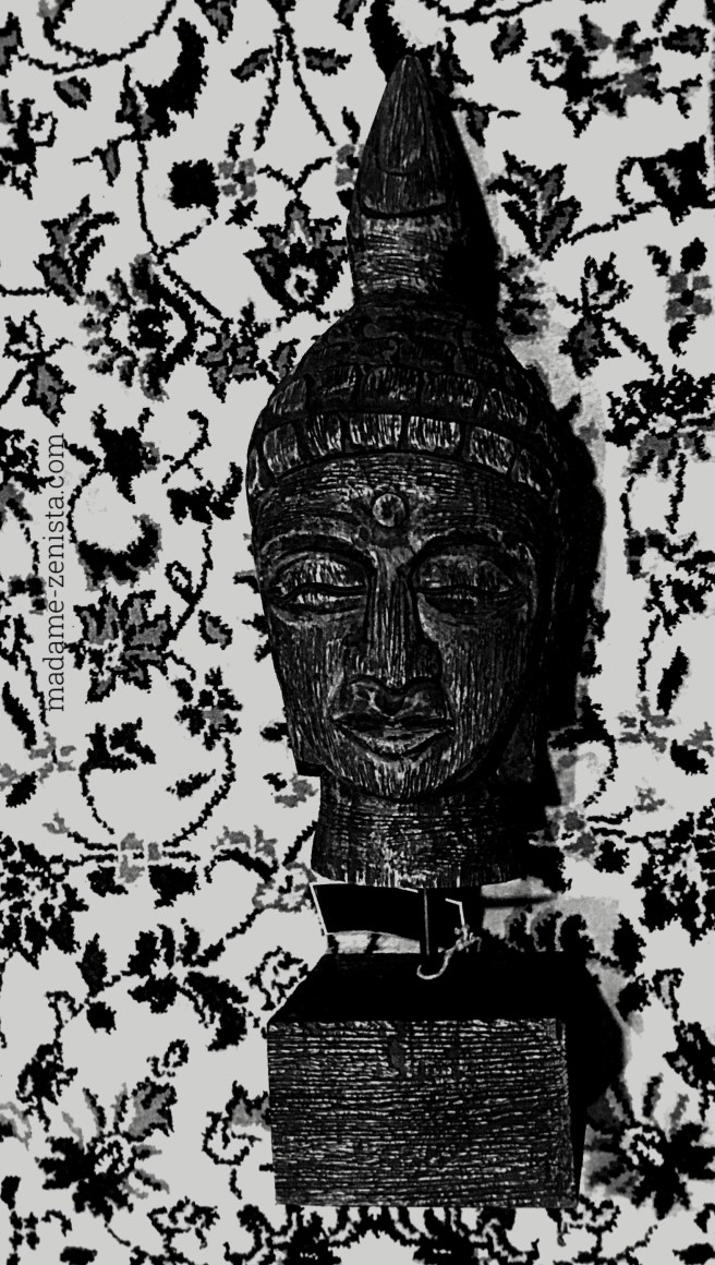 Unmoved. Still. Rooted in the moment. The Wooden Buddha